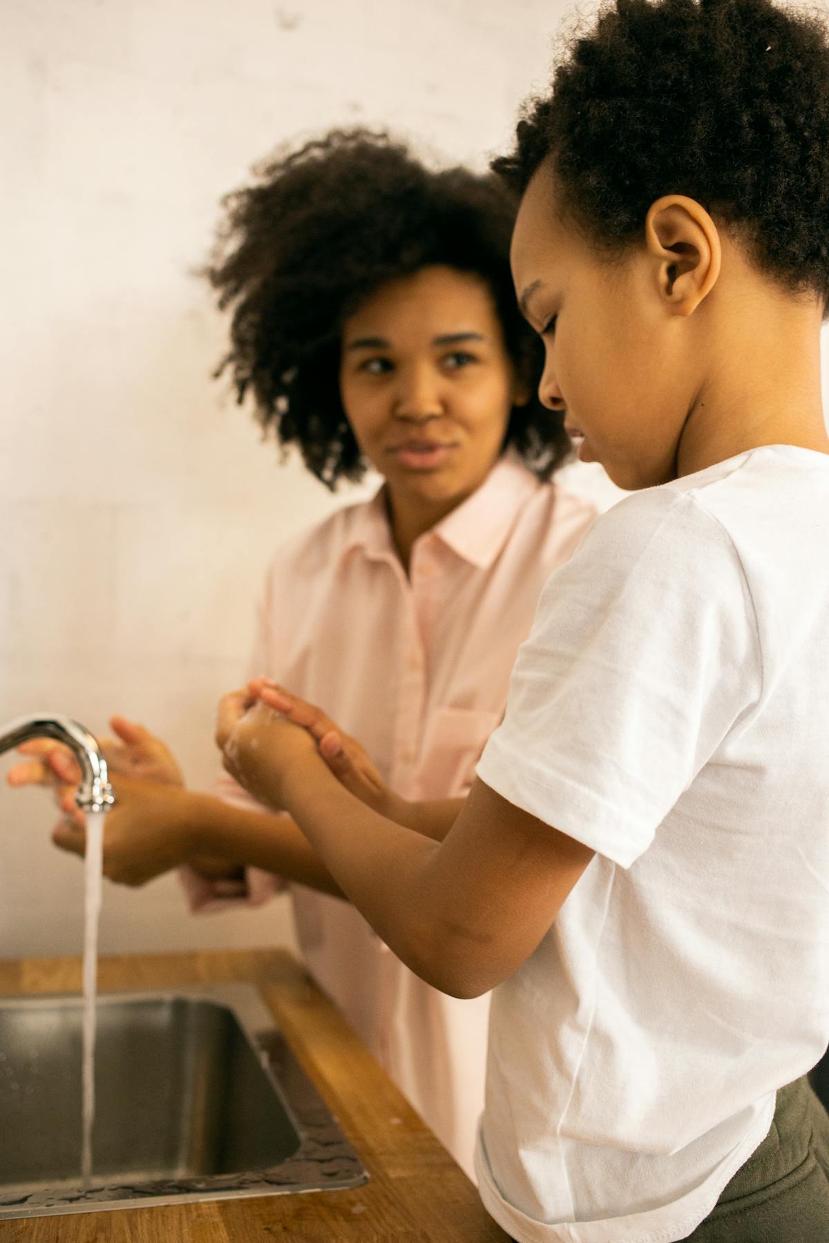 Happy family enjoying clean soft water at home after Pure Water Filtration LLC installation in Brighton Michigan